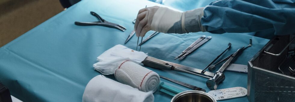 Anonymous nurse preparing equipment for the surgery